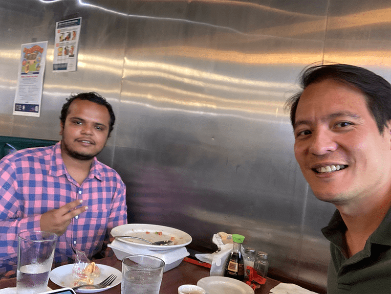 Dr. Panganiban and a lab member enjoying a meal.