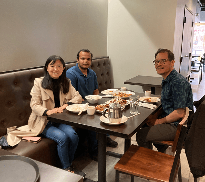 Dr. Panganiban and lab members enjoying a meal.