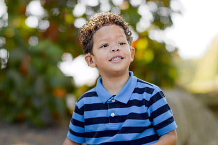 young boy with disability and hearing loss.