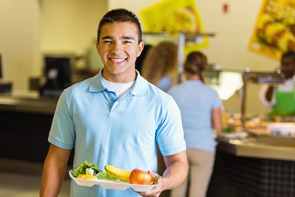 Student with lunch tray.