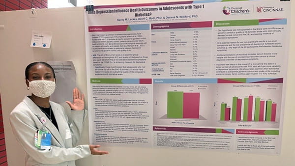 A photo of a student presenting research findings.