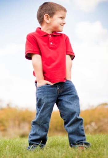 Child standing in a field Child standing in a field