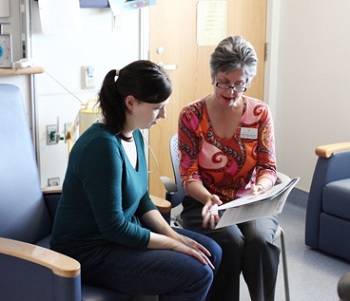 Parent and provider in conversation.