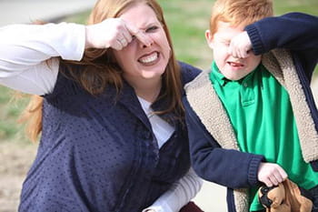 child playing with mom.