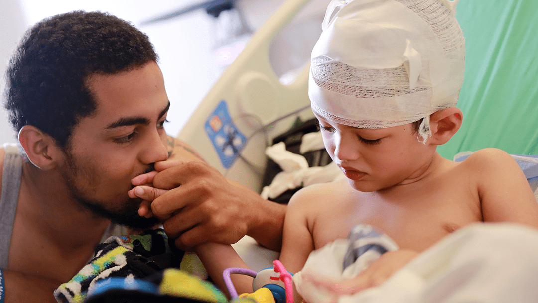 An image of an epilepsy surgery patient and his dad.