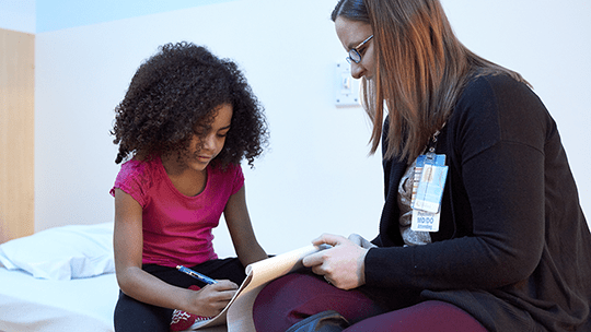 An image of a patient and a clinician.