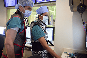 An image of Cincinnati Children's cardiologists prepping for a procedure.