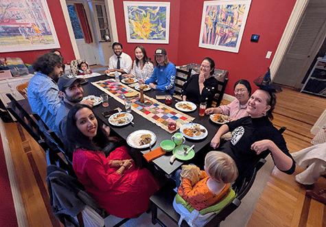 Faiz Rizvi’s thesis defense celebration with lab and family (2025).