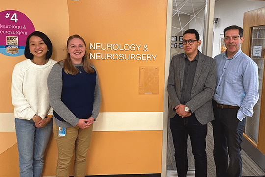 The Mangano / Goto Lab smiling for a picture.