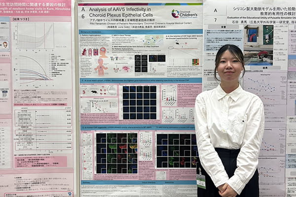 Medical student presenting her poster.