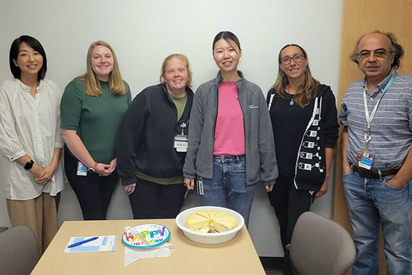 The lab celebrating medical student finishing rotation.