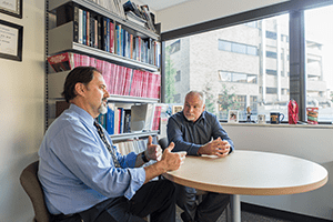 An image of Drs. Hershey and Powers talking.