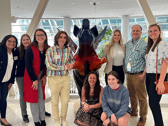 An image of the Evanson Lab at a conference.