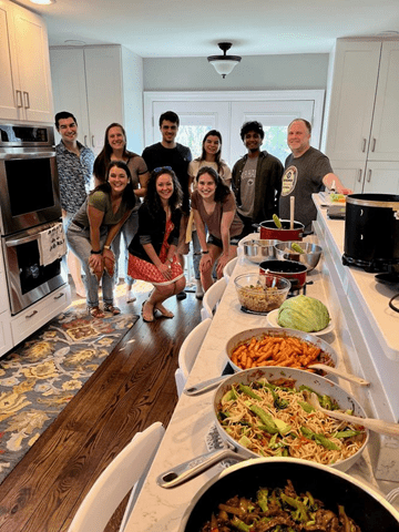 An image of the Evanson Lab enjoying dinner.