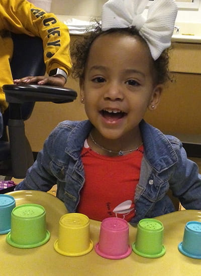 Two year old patient receiving speech-language and hearing test