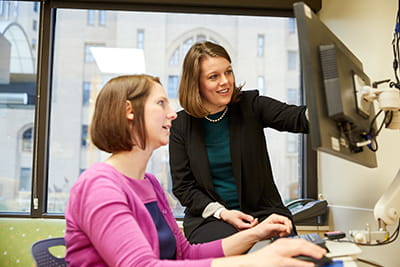 research nurses looking at a computer screen