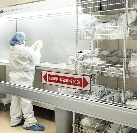 Investigational Drug Service employee working in the pharmacy.