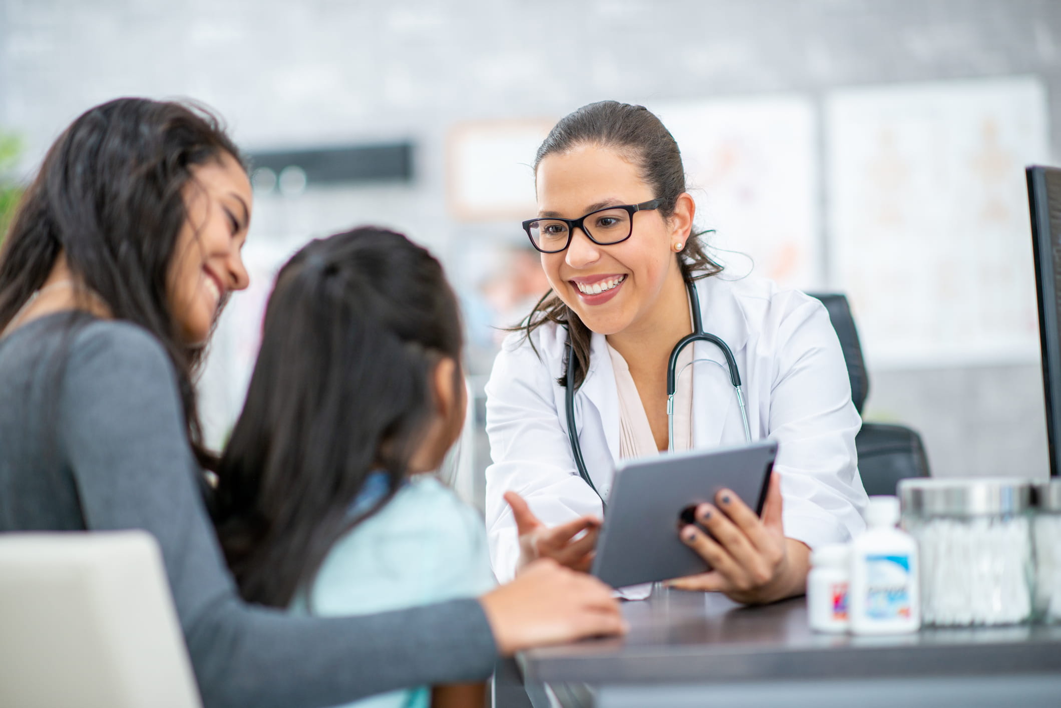 Healthcare worker uses software to improve care.