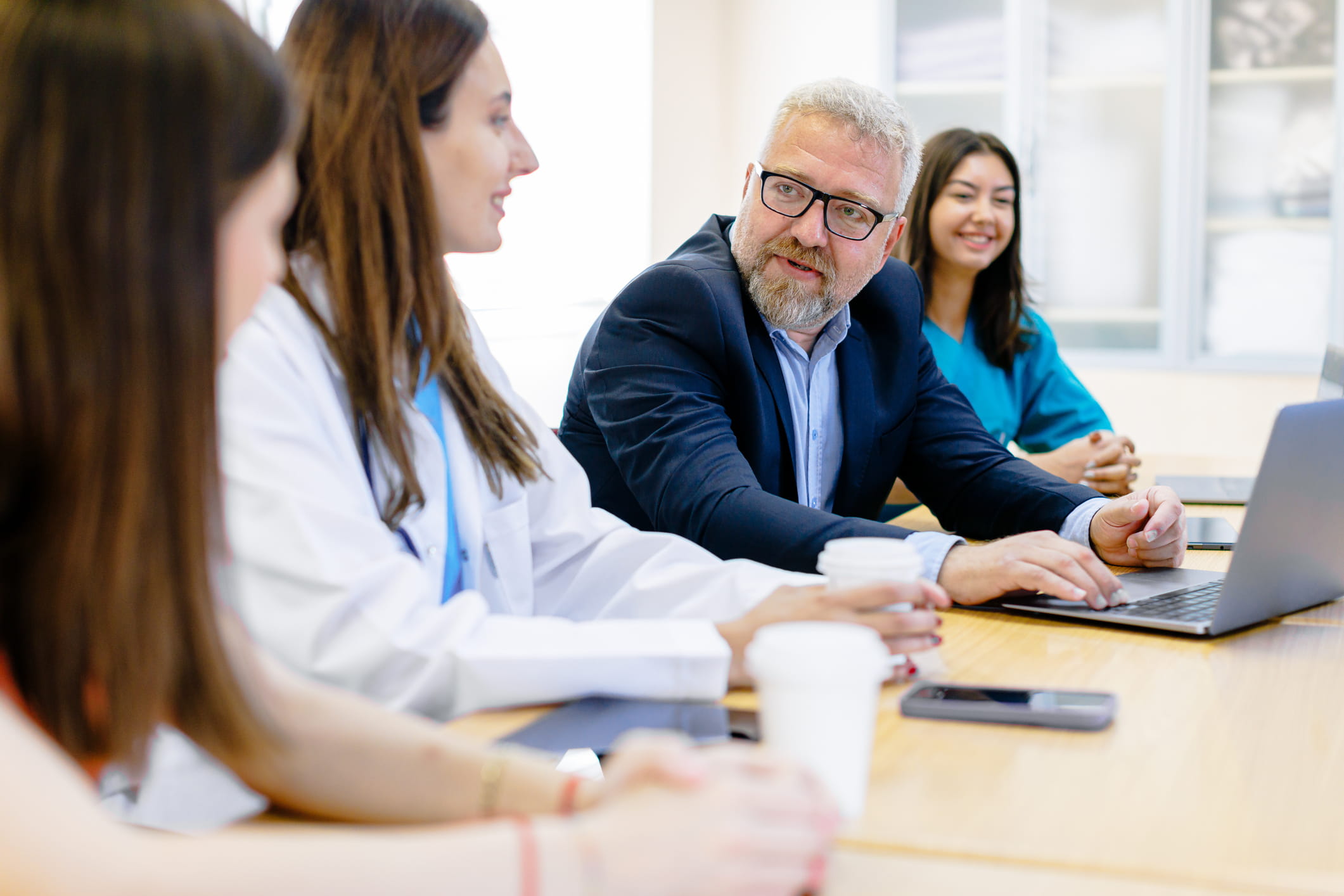 Clinical innovators confer with an investor.