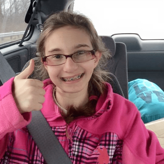 Katie gives a thumbs up. 