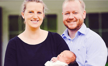 A picture of an ACHD patient with her husband and baby.