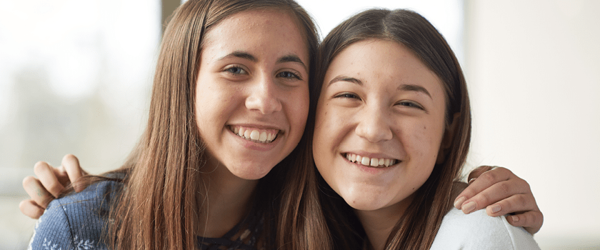 Two teen girls smiling
