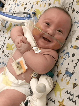 Levi smiles in the NICU.