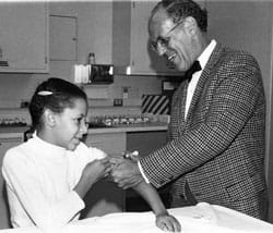 Joseph E. Ghory, M.D. treats a patient. 