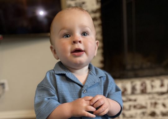 Fletcher St. Jean received innovative care for his abnormal heart rhythm. He's standing in his home after recovery.