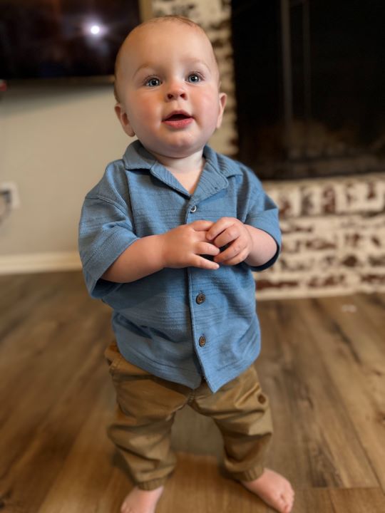 Fletcher St. Jean received innovative care for his abnormal heart rhythm. He's standing in his home after recovery.