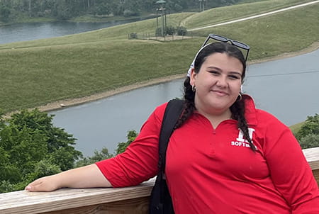 Ciara smiles outside.