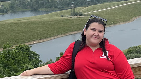 Ciara smiles outside.