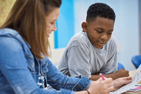 A patient working in clinic with a provider.