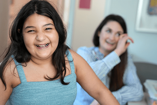 Makenzie smiles during a clinic visit.