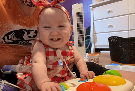 Harper smiles and plays.