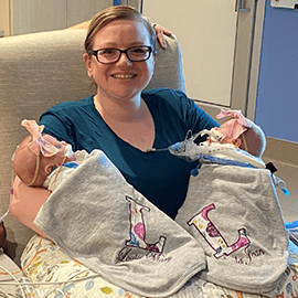 Lynae holds twins Layla and Louise.