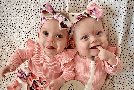 Layla and Louise smile.