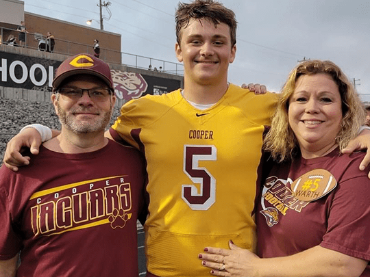 Drew with his parents.