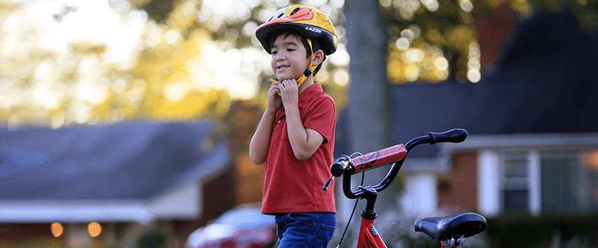 An image of a child biking outside.