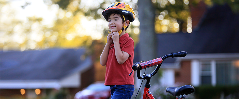 An image of a child biking outside.