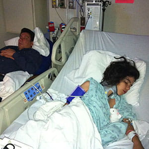 An image of Ella and her dad in the hospital.