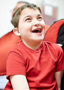 A CHARGE patient smiling.