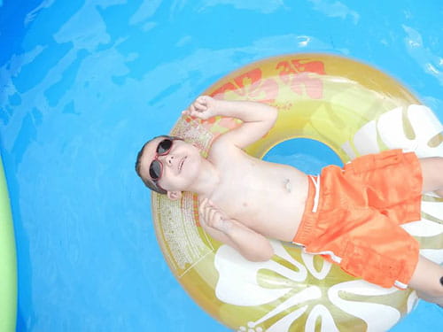Logan swimming in the pool.