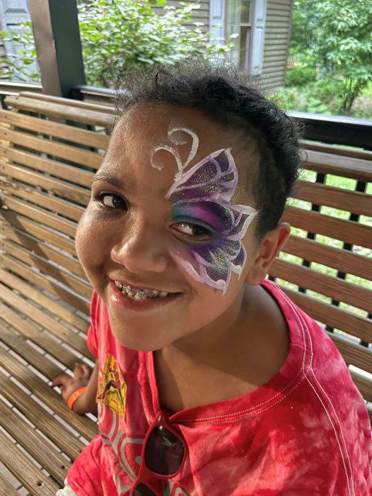 Camper with face paint.