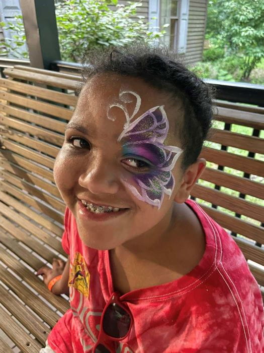 Camper with face paint.