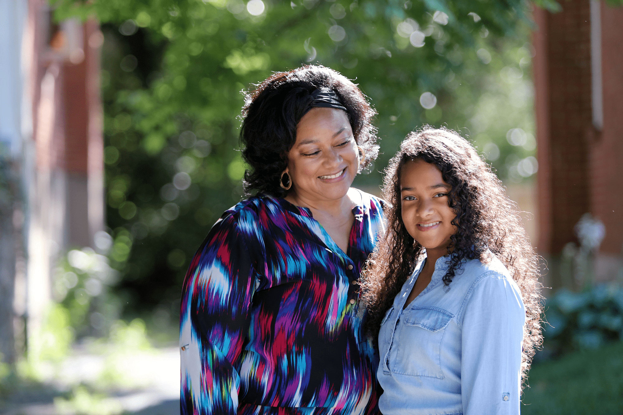 A Cincinnati Children's patient standing with her mother.