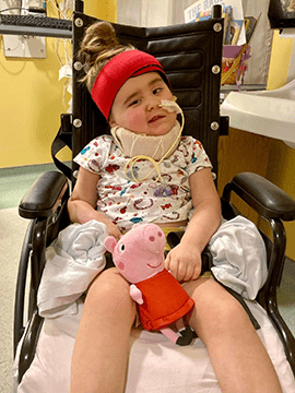 Julianne sits in a wheelchair.