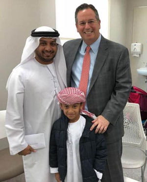 Jason Frischer, MD, with a family from the United Arab Emirates.