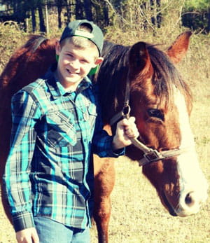 Colorectal patient Jon Morton with horse.