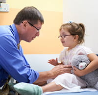 Doctor examines a patient.